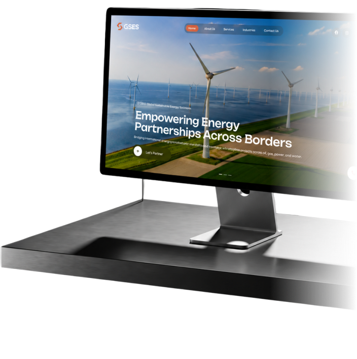 Custom CMS website shown on a desktop monitor — empowering energy partnerships across borders